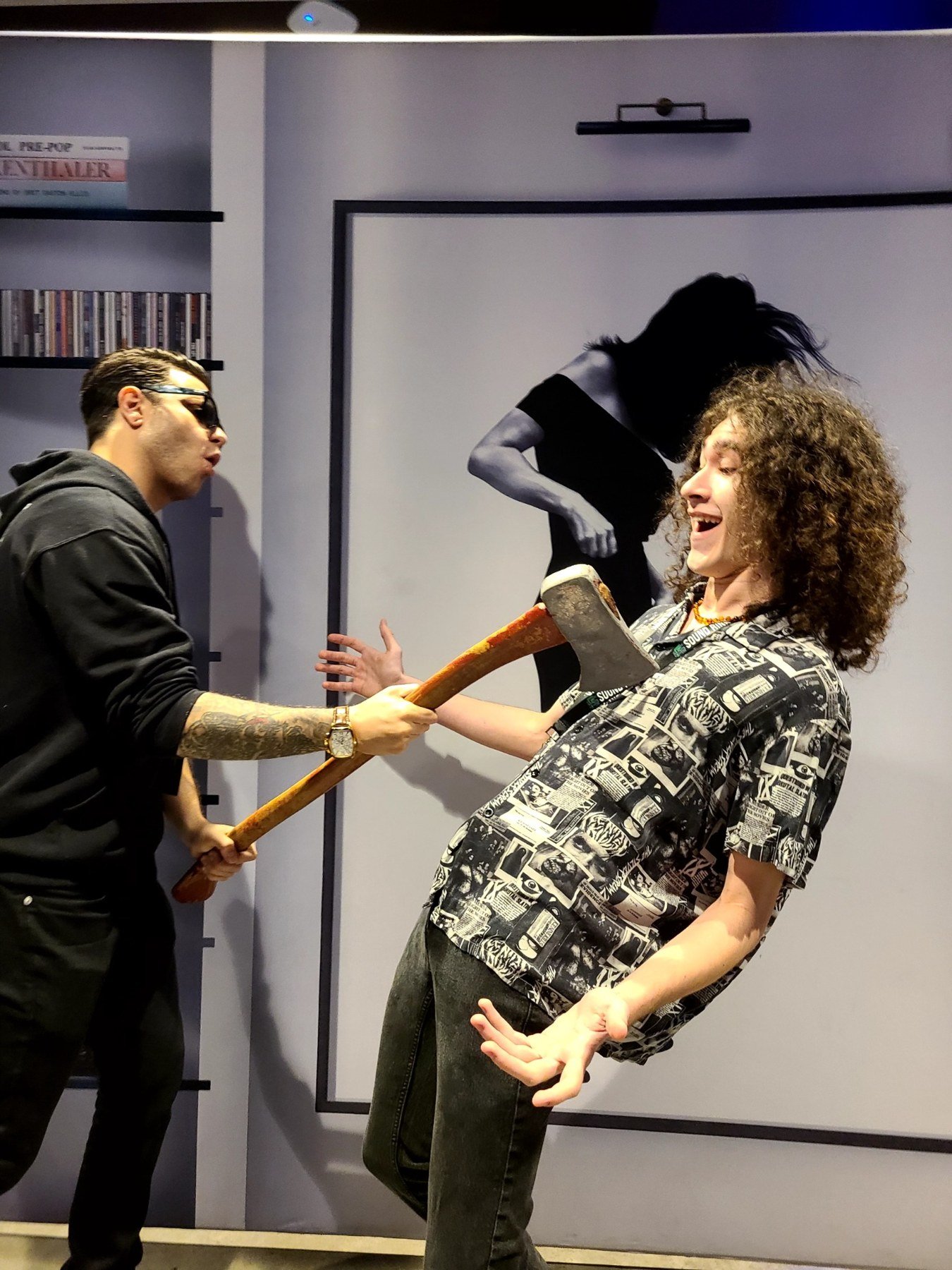 Milo Powers posing with an axe prop backstage