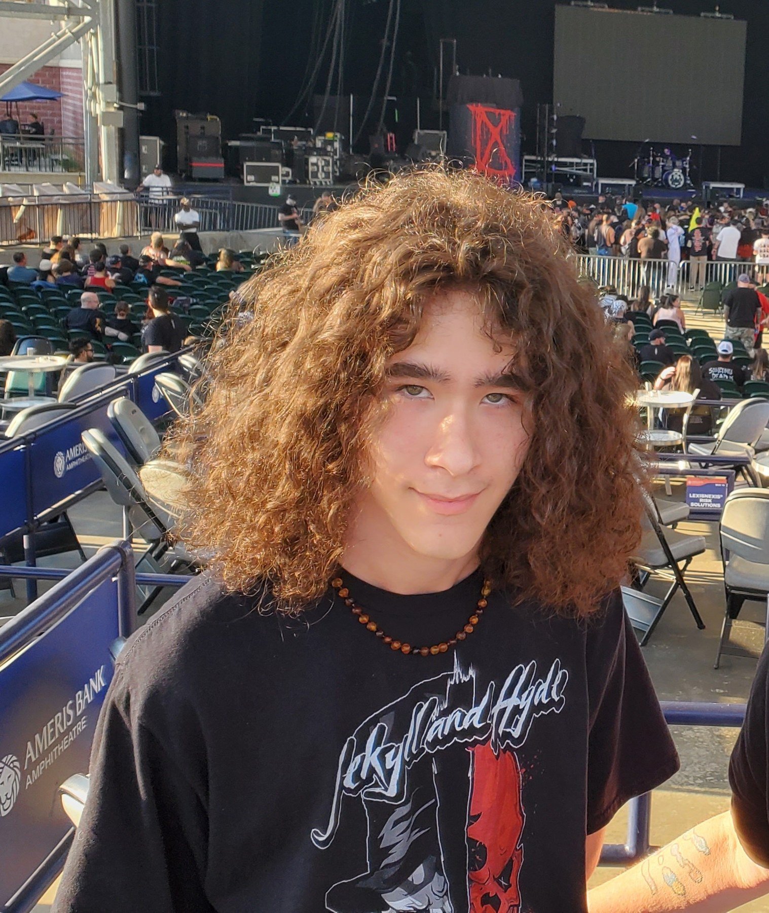 Close portrait of Milo Powers at a concert venue